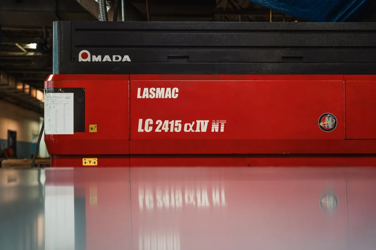 Amada LASMAC LC 2415 CO2 laser, wide view of the red machine face
