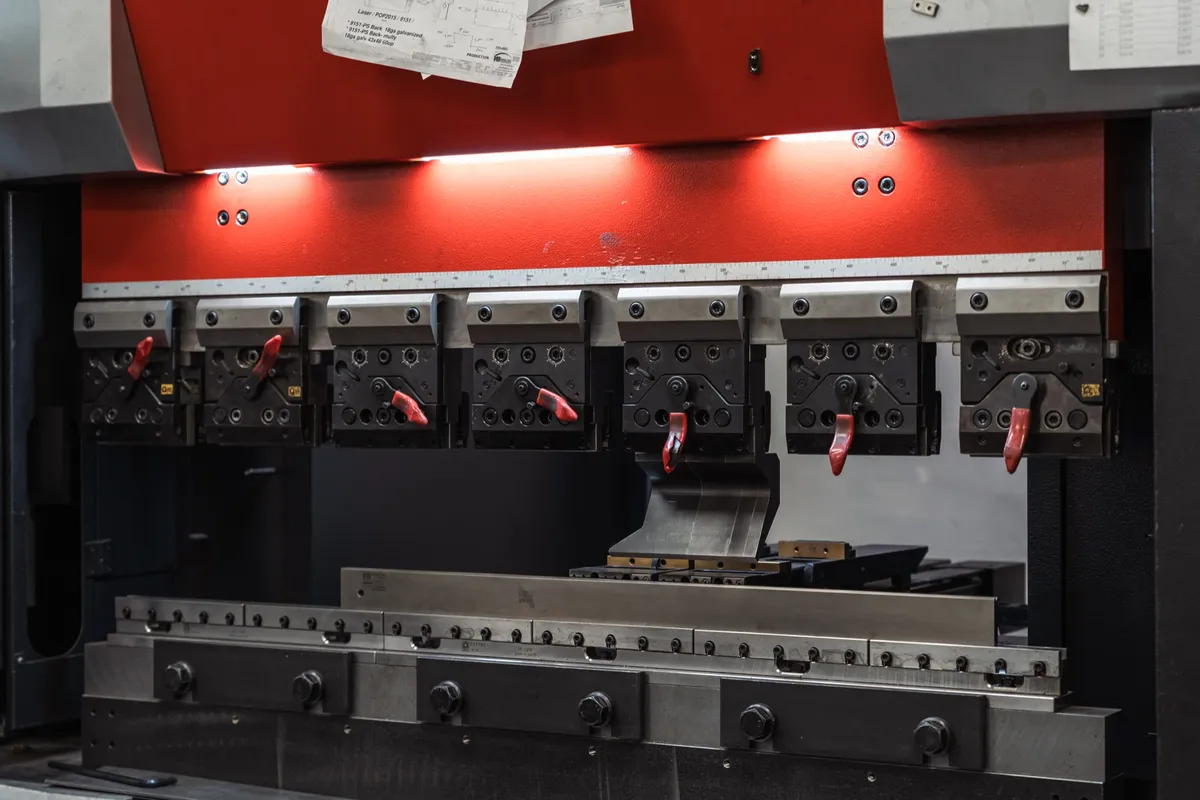 Row of red press brake tooling stations