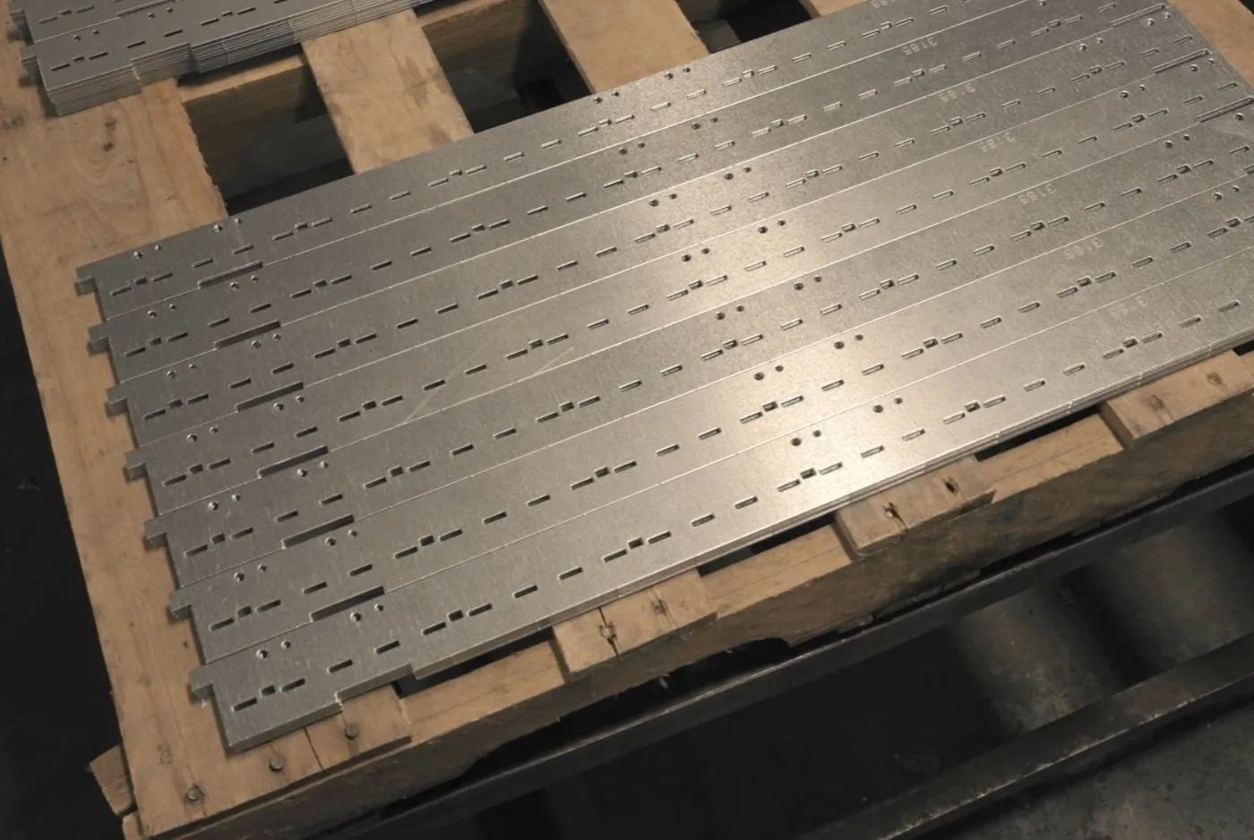 Punched and nested sheet metal blanks stacked on a pallet