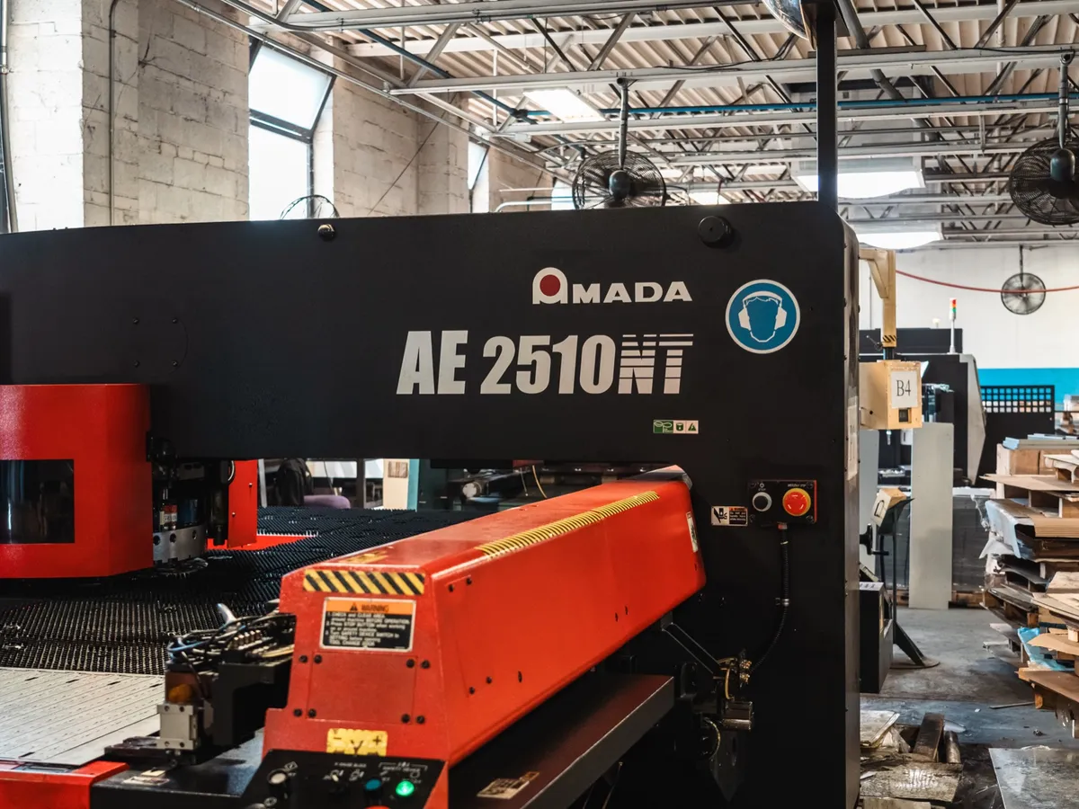 Amada AE 2510NT CNC turret punch with the machine name visible