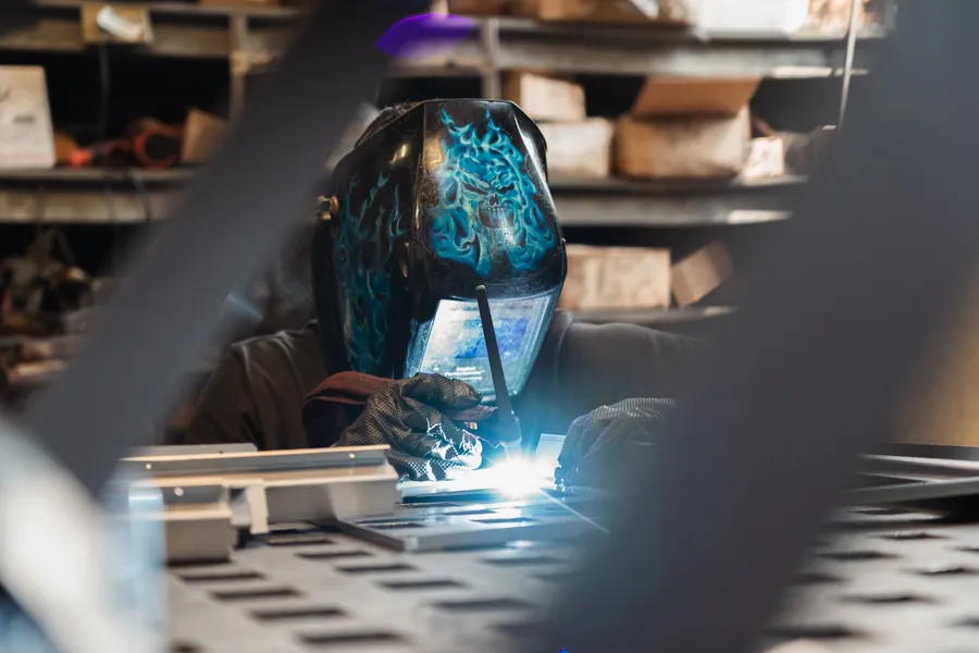 Live welding arc flaring blue-white